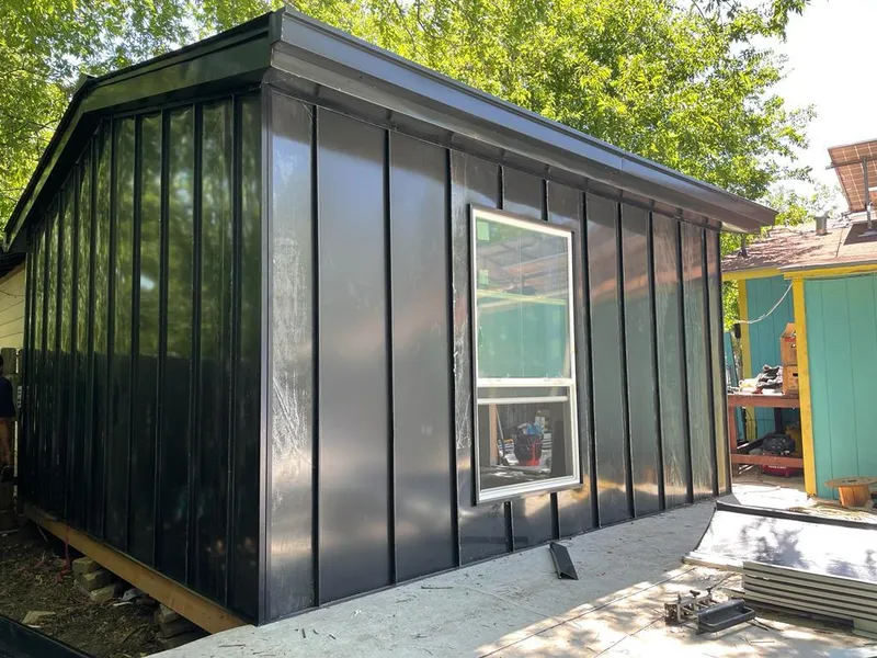 Black standing seam metal wall panels for Roof Inspection in Altamont