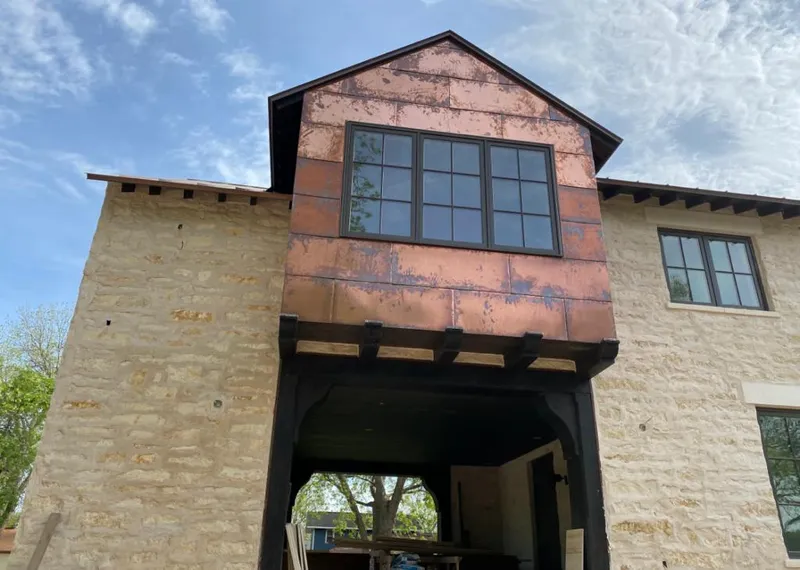 Copper metal panel facade on a stone building for Metal Roof Coating in Altamont